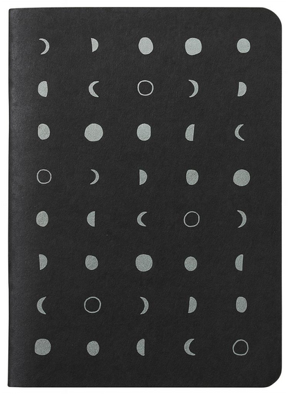 Black notebook with white moon phase pattern