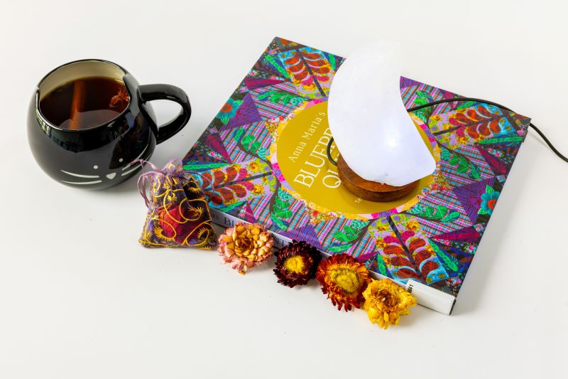 Tea packaging with a mug of tea and flowers on a white background