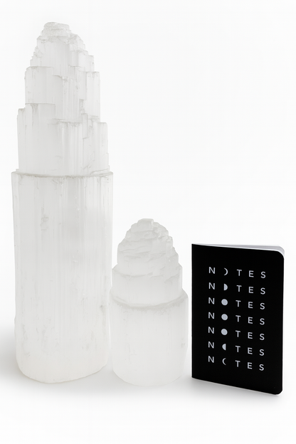 Decorative white ice cream cone-shaped objects with a black notebook labeled 'NOTES' on a white background