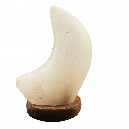 Decorative item resembling a crescent moon on a wooden base against a white background